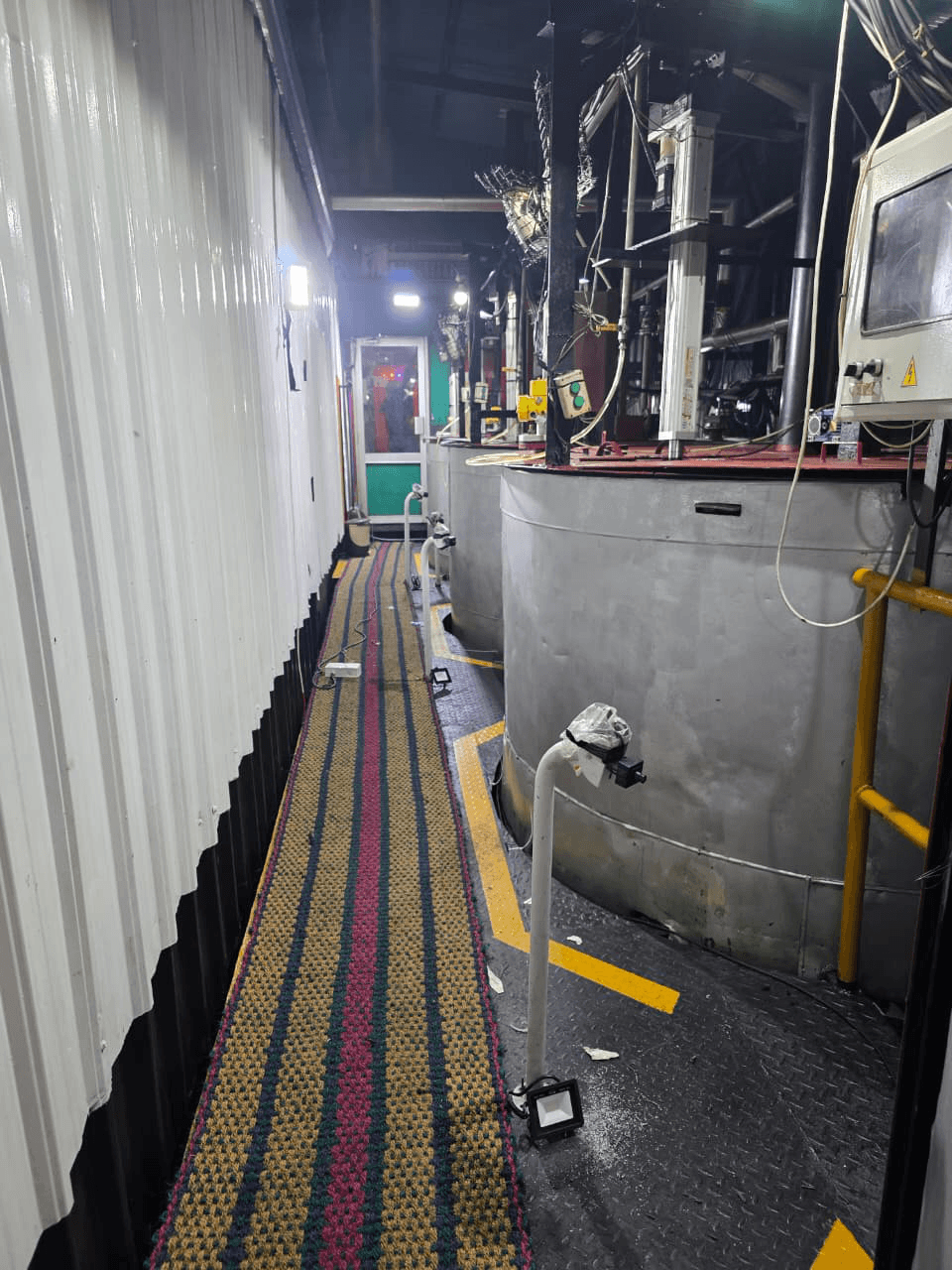 Apparel manufacturing facility floor showing manual inspection points